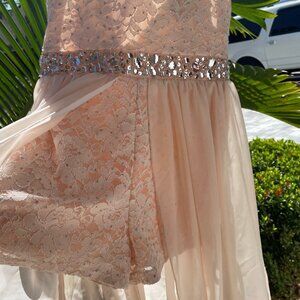 Girls amazingly beautiful high-low romper dress with sequins and sheer overlay.